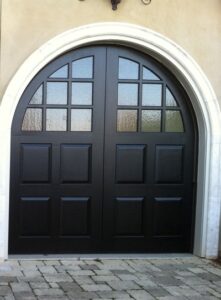 Custom arched entry doors with walnut finish