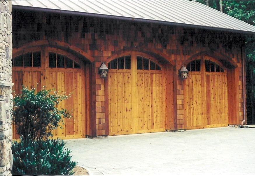 Custom arched garage doors with glass panels